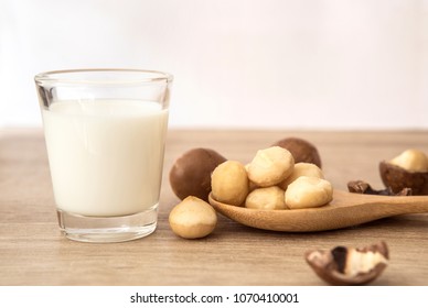 Close Up A Macadamia Nut Milk On Wooden Table , Low Fat Healthy Drink .