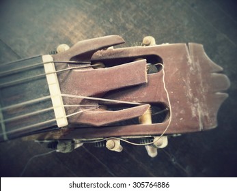 Close Up Machine Neck Of Broken Guitar