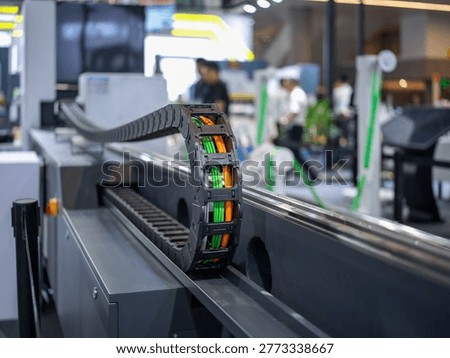 Close up of machine tool drag chain at industrial trade show site