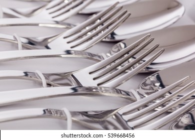 Close up macro detail of a flatware box set with forks and spoons.