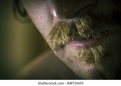 Close up macro dramatic serious mustache and facial hair