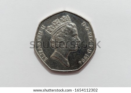 A close up macro image of the Obverse side of a British 50p coin issued in 1994 showing a detailed portrait of Queen Elizabeth II.  