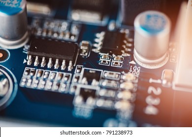 Close up macro on electronic system with integrated circuit chip and capacitors