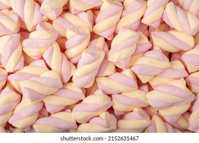 Close up macro photograph of pink and yellow marshmallow twisted candy abstract background - Powered by Shutterstock