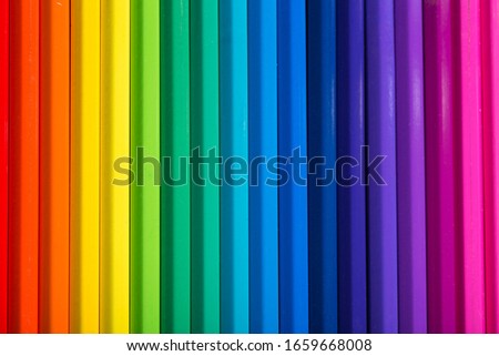 close up macro shot of colorful pencils on  black background