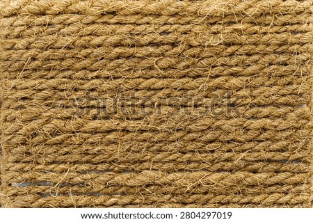 Close up macro texture of tightly coiled natural rattan rope background