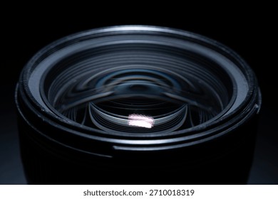 Close macro view of modern camera lens glass with reflective optical patterns