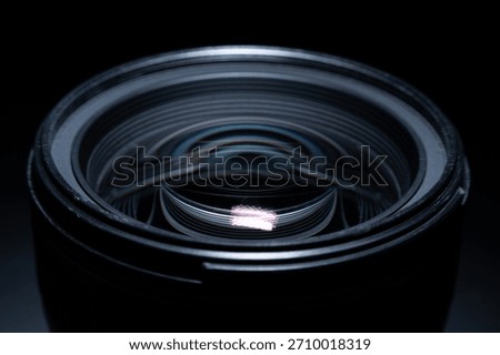 Close macro view of modern camera lens glass with reflective optical patterns
