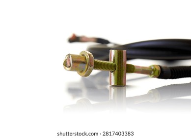 Close up macro view of motorcycle control cable adjuster featuring yellow zinc plated threaded rod, cylindrical barrel trunnion, hex locknut, and flexible cable sheath, professional studio product photography shot on reflective white background showcasing bike mechanics hardware.