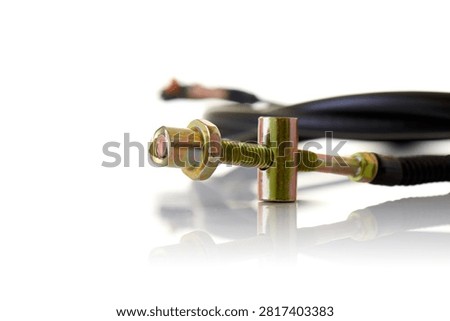 Close up macro view of motorcycle control cable adjuster featuring yellow zinc plated threaded rod, cylindrical barrel trunnion, hex locknut, and flexible cable sheath, professional studio product photography shot on reflective white background showcasing bike mechanics hardware.