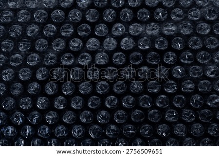 Close up macro view of plastic bubble wrap bubbles for fragile item protection