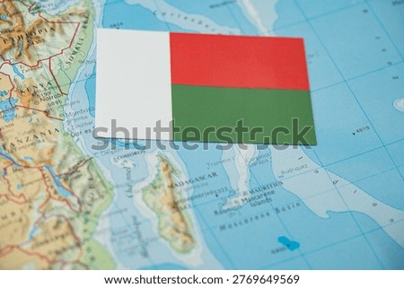 Close up of Madagascar flag on map of Madagascar.