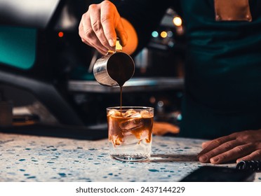 Close up of male barista hand making coffee tonic. - Powered by Shutterstock