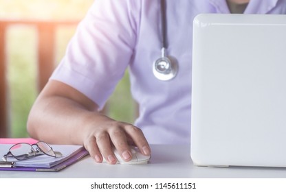 Close Up Of Male Doctor Hand Click Mouse.