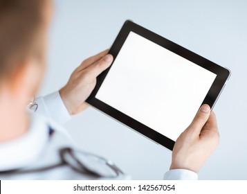 Close Up Of Male Doctor Hands Holding Tablet Pc