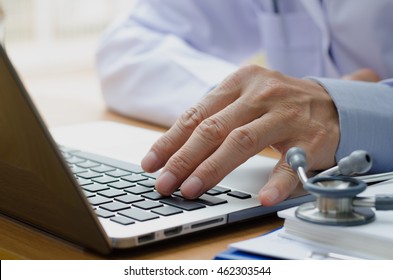 Close Up Of Male Doctor With Laptop Computer, Electronic Health Records EHRs, Electronic Medical Records System EMRs, Telemedicine Concept.