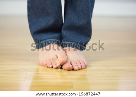 Close up of male feet on wooden floor