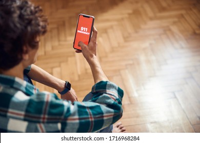 Close up of male hand holding cellphone with 911 on display stock photo
