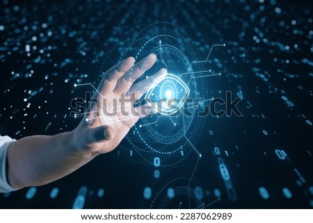 Close up of male hand holding cyber spy technology hologram, virtual eye of internet control surveillance and digital invigilation background with coding