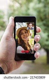 Close Up Of A Male Hand Holding A Smart Phone During A Video Call With His Girlfriend