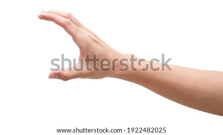 Close up male hand holding something like a bottle or can isolated on white background with clipping path.