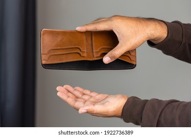 Close Up Male Hand Open The Empty Wallet.There Is No Money In Wallet. Financial Business Concept.