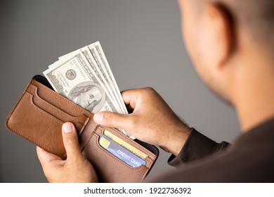 Close Up Male Hand Open The Wallet.He Has Lot Money Us Dollar In Wallet. Financial Business Concept.