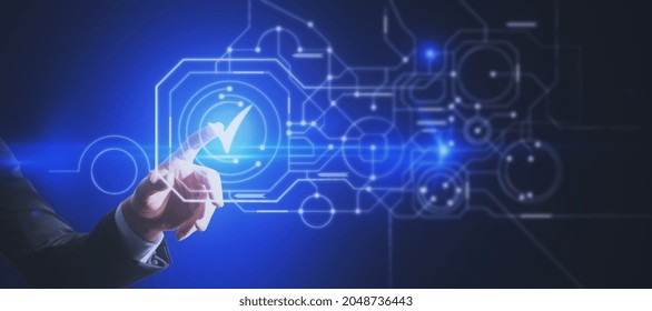 Close Up Of Male Hand Pointing At Abstract Glowing Digital Business Circuit Network And Tick Mark Interface On Blurry Background. Technology, Choice And Completion Concept. Double Exposure