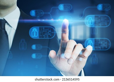 Close up of male hand pointing at abstract big data and security nodes hologram on blurry background. Technology, web safety and programming concept. Double exposure - Shutterstock ID 2136514595