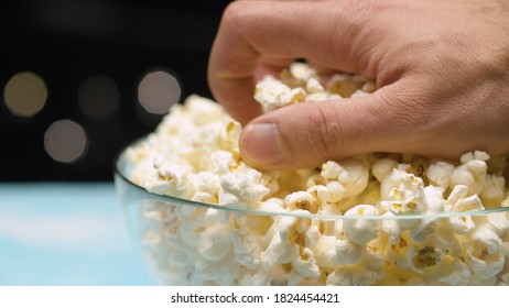 Close Up Male Hand Taking Popcorn From Glass Bowl