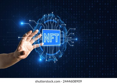 Close up of male hand using creative glowing nft circuit hologram on dark background. Non fungible token and cryptocurrency concept