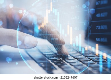 Close up of male hand using laptop keyboard with abstract falling candlestick forex chart on blurry background. Crisis, workplace and stock concept. Double exposure
