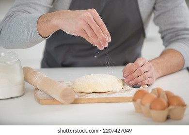 Close Up Of Male Hands Kneading Dough