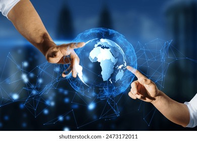 Close up of male hands pointing at glowing globe hologram on blurry night city background. World map, connect and earth concept. Double exposure - Powered by Shutterstock