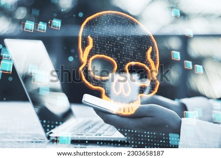 Close up of male hands using laptop and cellphone with glowing digital binary code skull on blurry outdoor background. Hacking, piracy, malware and data theft concept. Double exposure