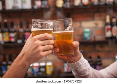 Close Up Of Male Hans With Beer Glasses Clinking