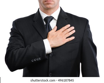 Close up male man businessman in suit and tie with hand over heart isolated on white background
