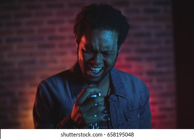 Close Up Of Male Singer Performing In 