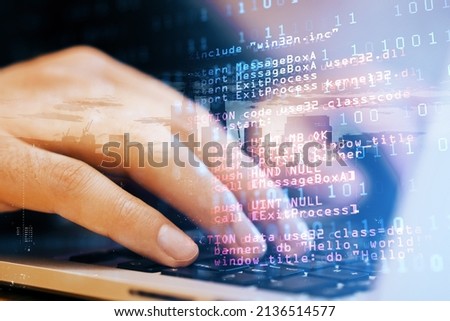 Close up of male student hand using laptop keyboard with abstract html code on creative city background. Coding and programming concept. Double exposure