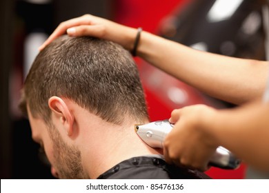 Close Up Of A Male Student Having A Haircut With Hair Clippers