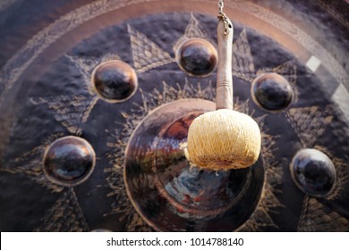 Close up mallet hanging on the blurred Big Gong at the Temple, Big gong in temple, Thailand, Big bell, copy space,