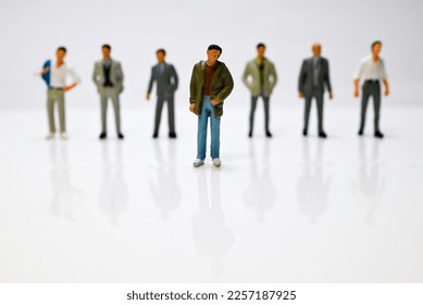 Close up of a man alienated from his colleagues in his company. - Shutterstock ID 2257187925