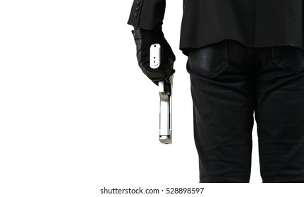 
Close Up Of Man In Business Suit Holding A Gun.
