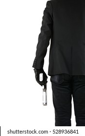 Close up of man in business suit holding a gun.