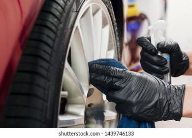 Close Up Of Man Cleaning Car Rims