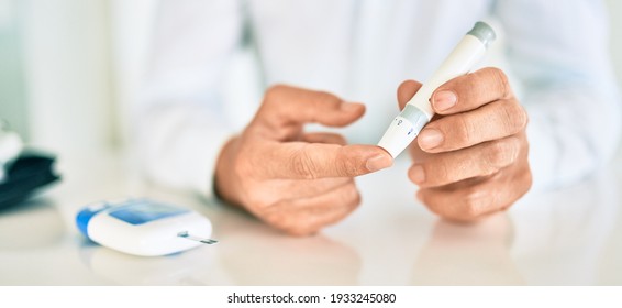 Close Up Of Man With Diabetes Using Insuline Stick With Syringe