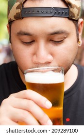 Close Up Of Man Drinking Beer 
