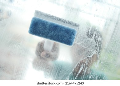 Close Up Of Man Hand Cleaning Window Glass 