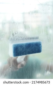 Close Up Of Man Hand Cleaning Window Glass 