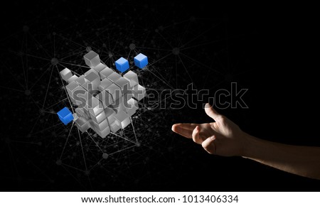 Close of man hand holding cube figure as symbol of innovation. Mixed media.